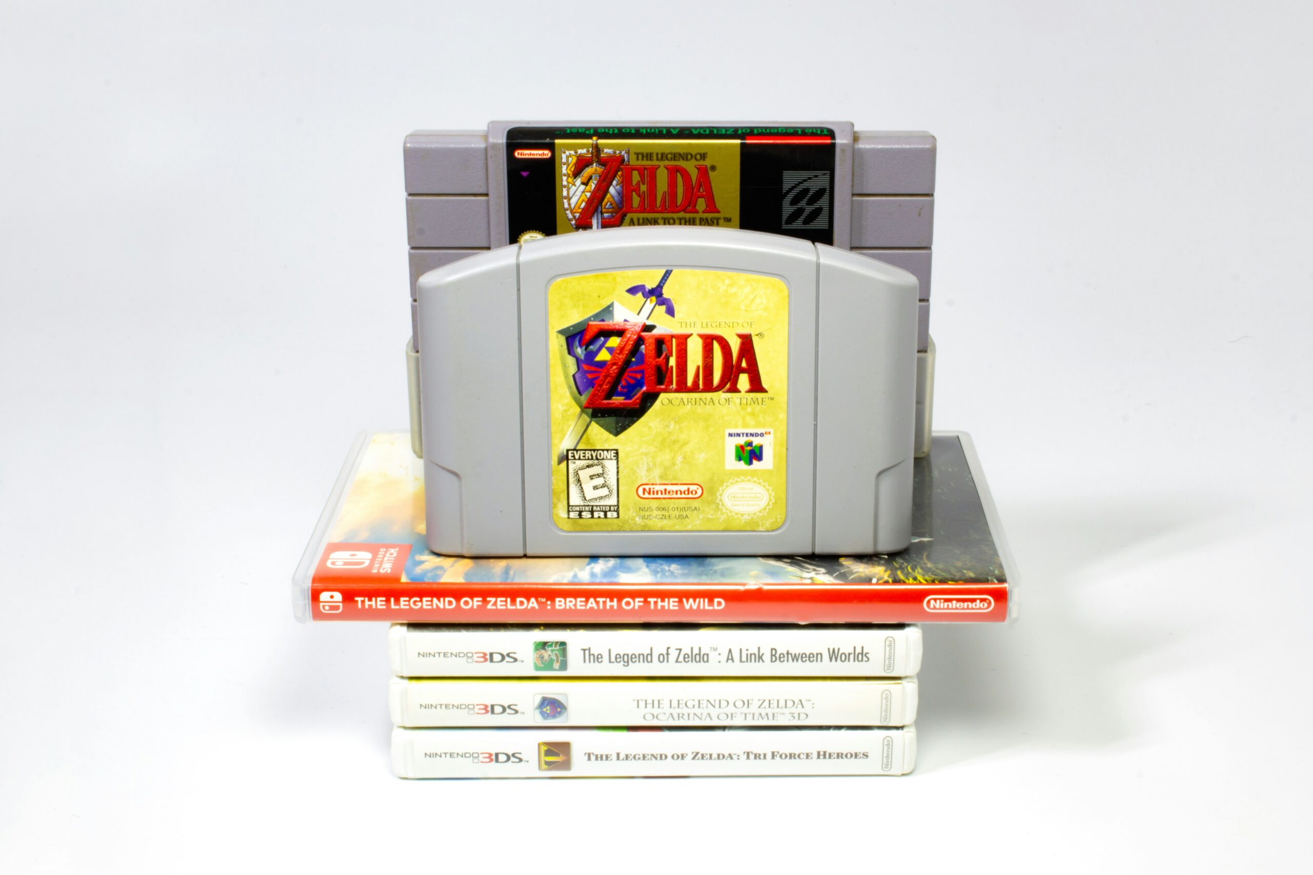 A stack of zelda video games representing the triforce and three jewels