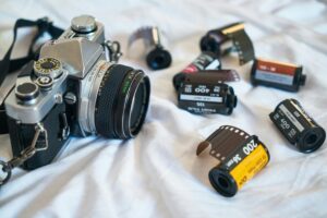 Film rolls and camera. The equipment you need to see the zen of film photography