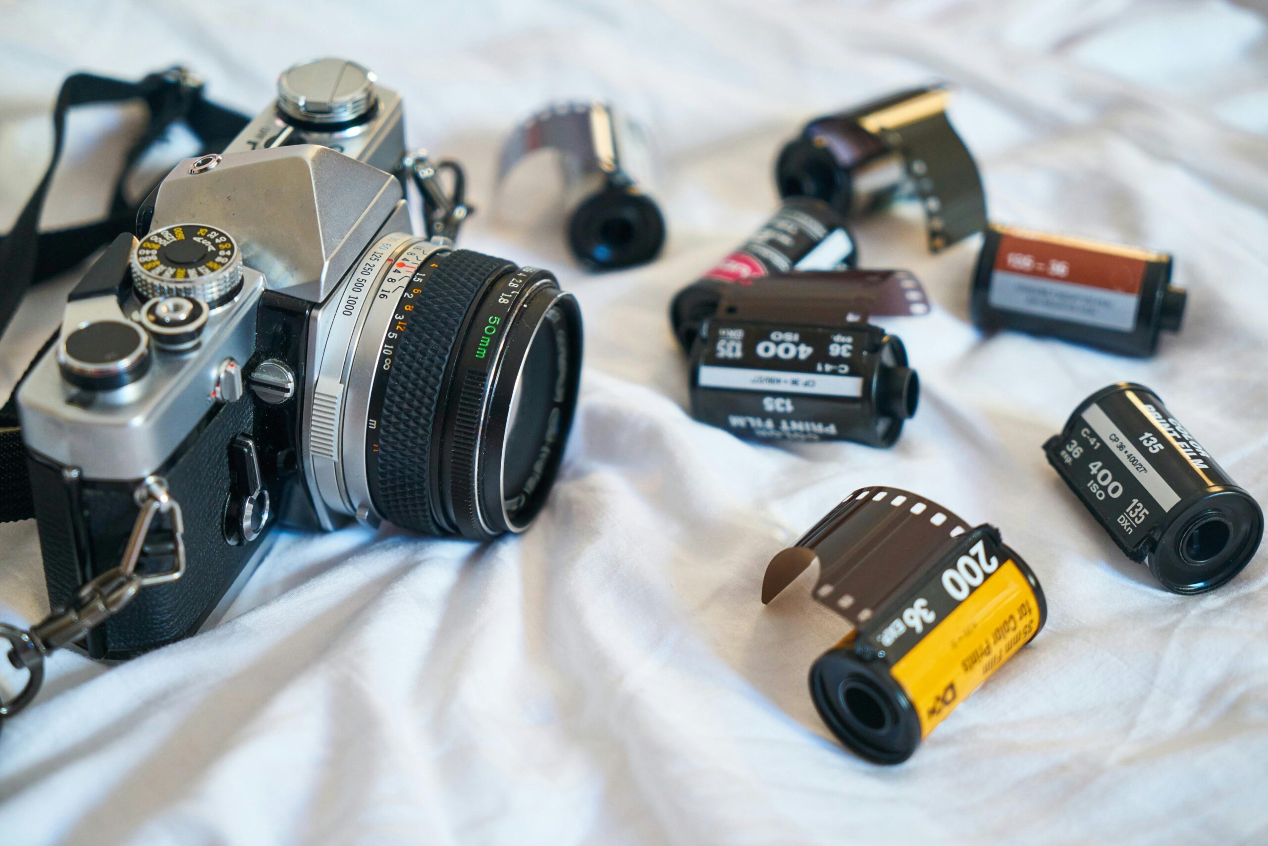 Film rolls and camera. The equipment you need to see the zen of film photography