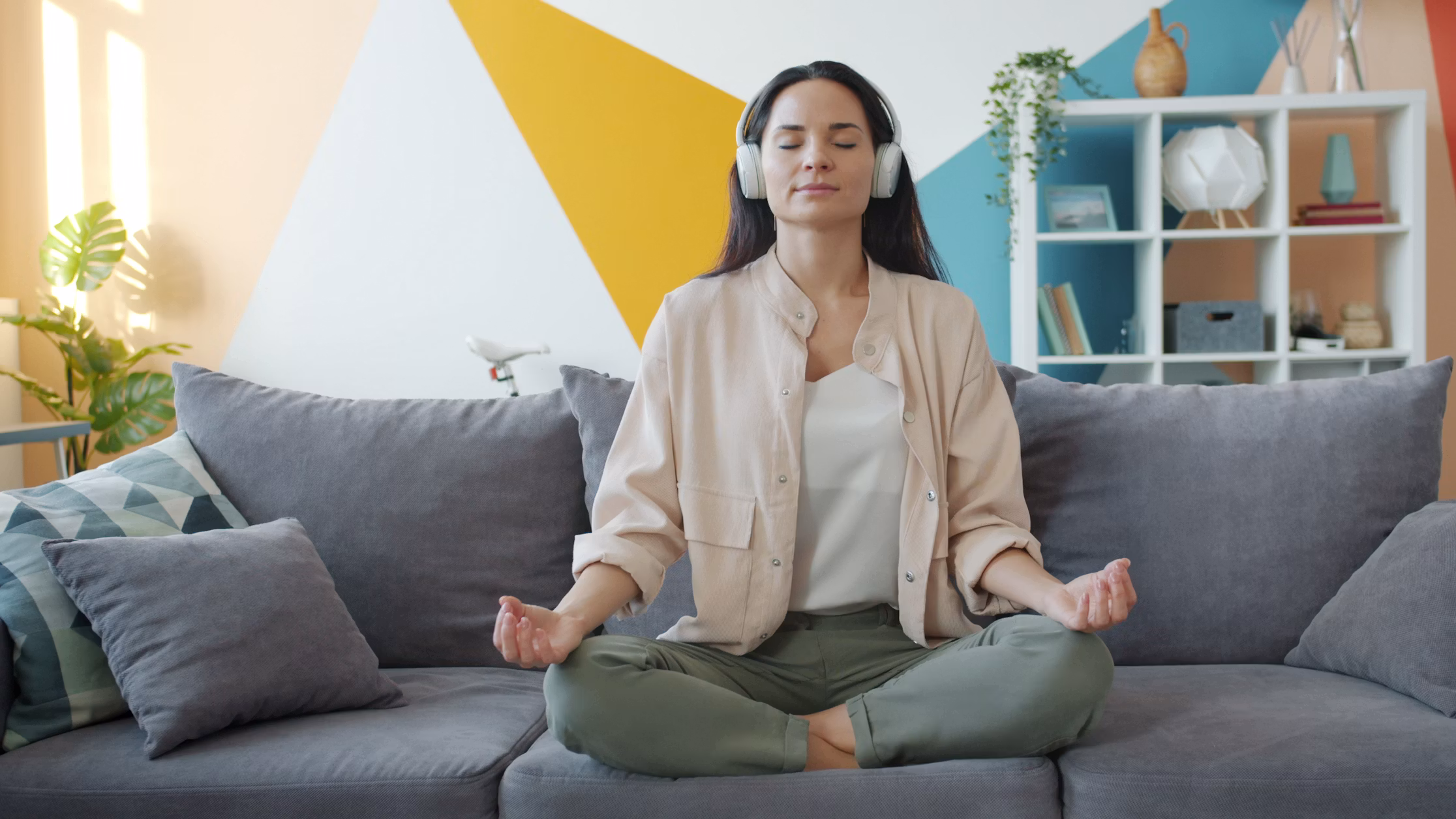 An image of a young woman enjoying a meditation app