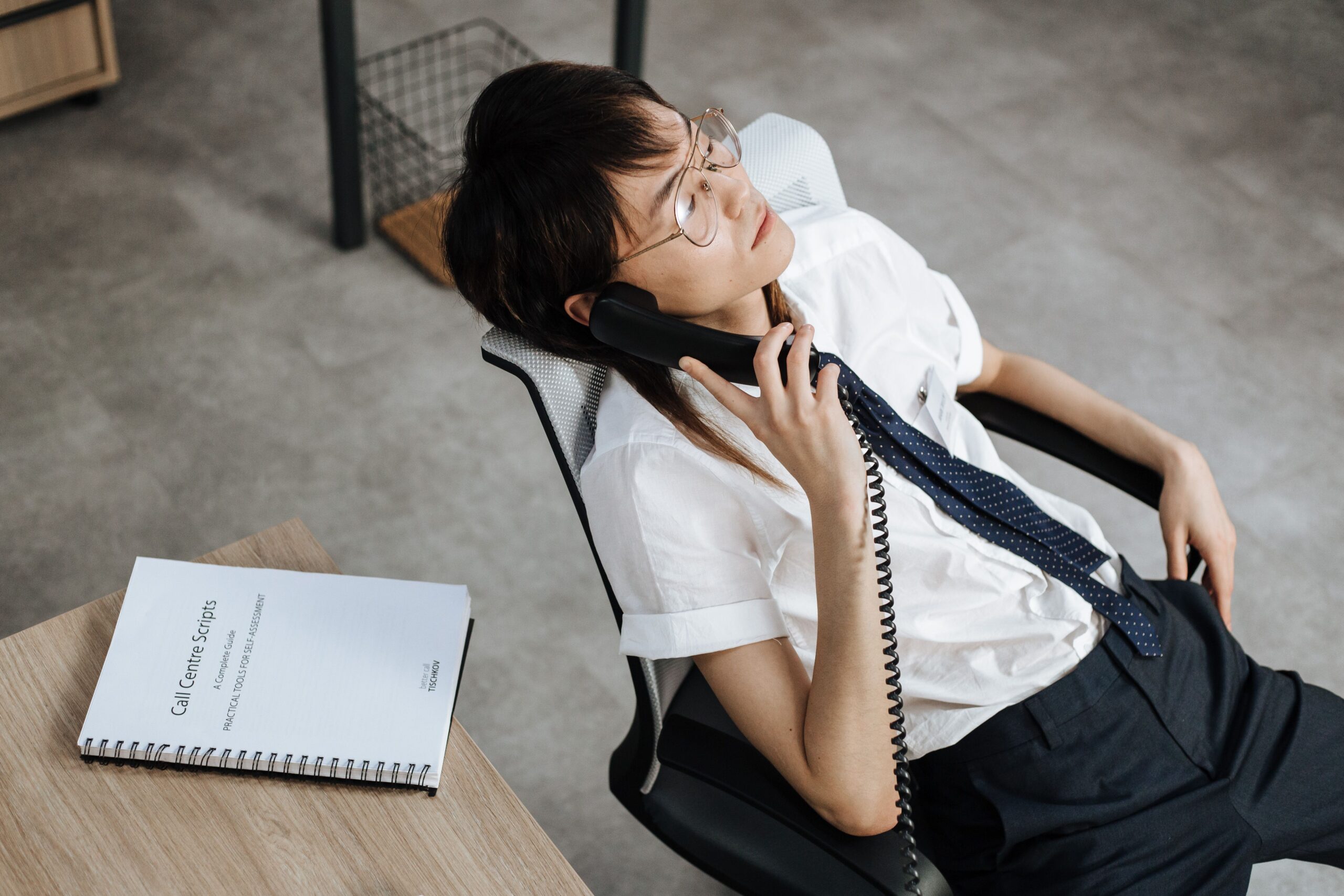 A bored office worker in need of Trataka meditation